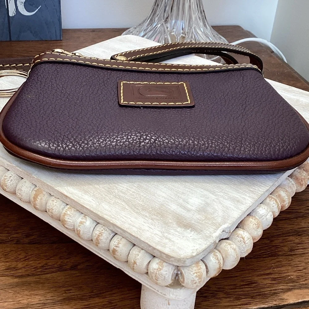 Dooney & Bourke pebbled deep purple and Brown Leather Wristlet, keychain